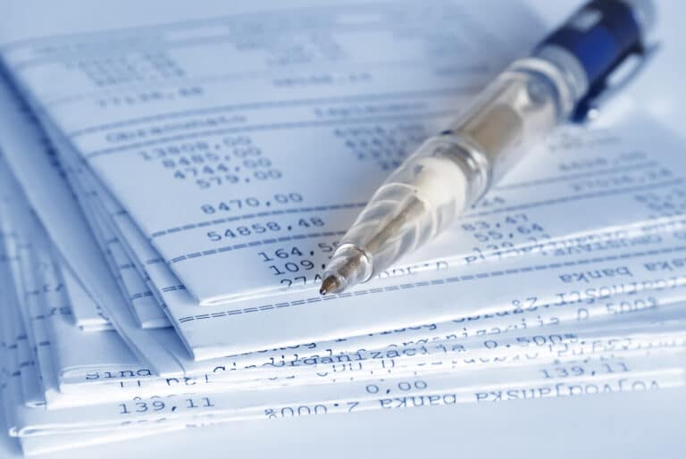 Banking reports on a folded sheets and pen