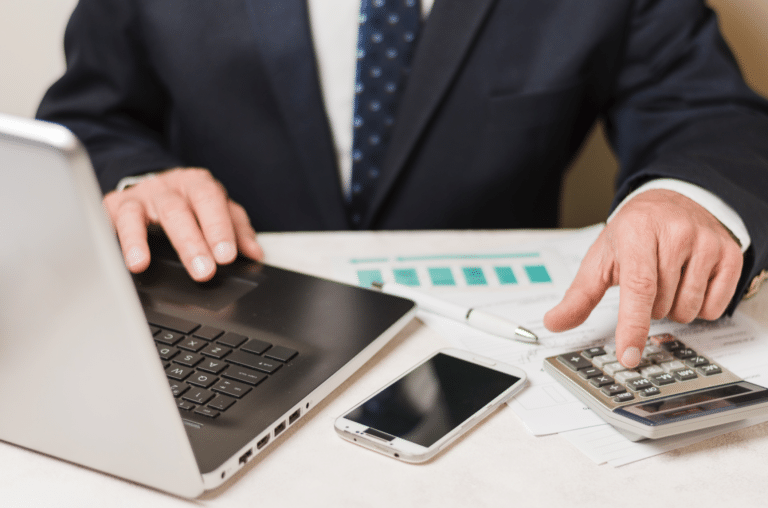 accountant using calculator